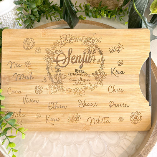 Personalized Wreath cutting board with names engraved around board
