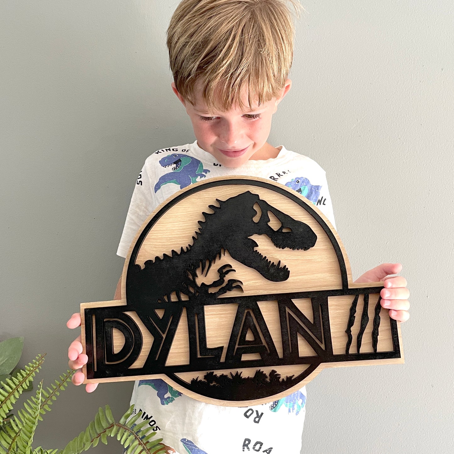 Wooden Personalised Dino Wall Plaque, Natual wood and black