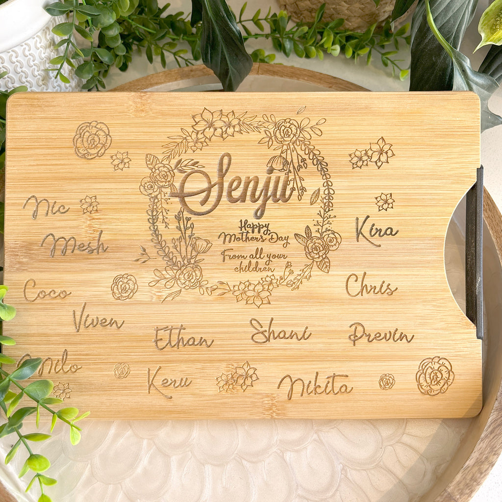 Personalized Wreath cutting board with names engraved around board