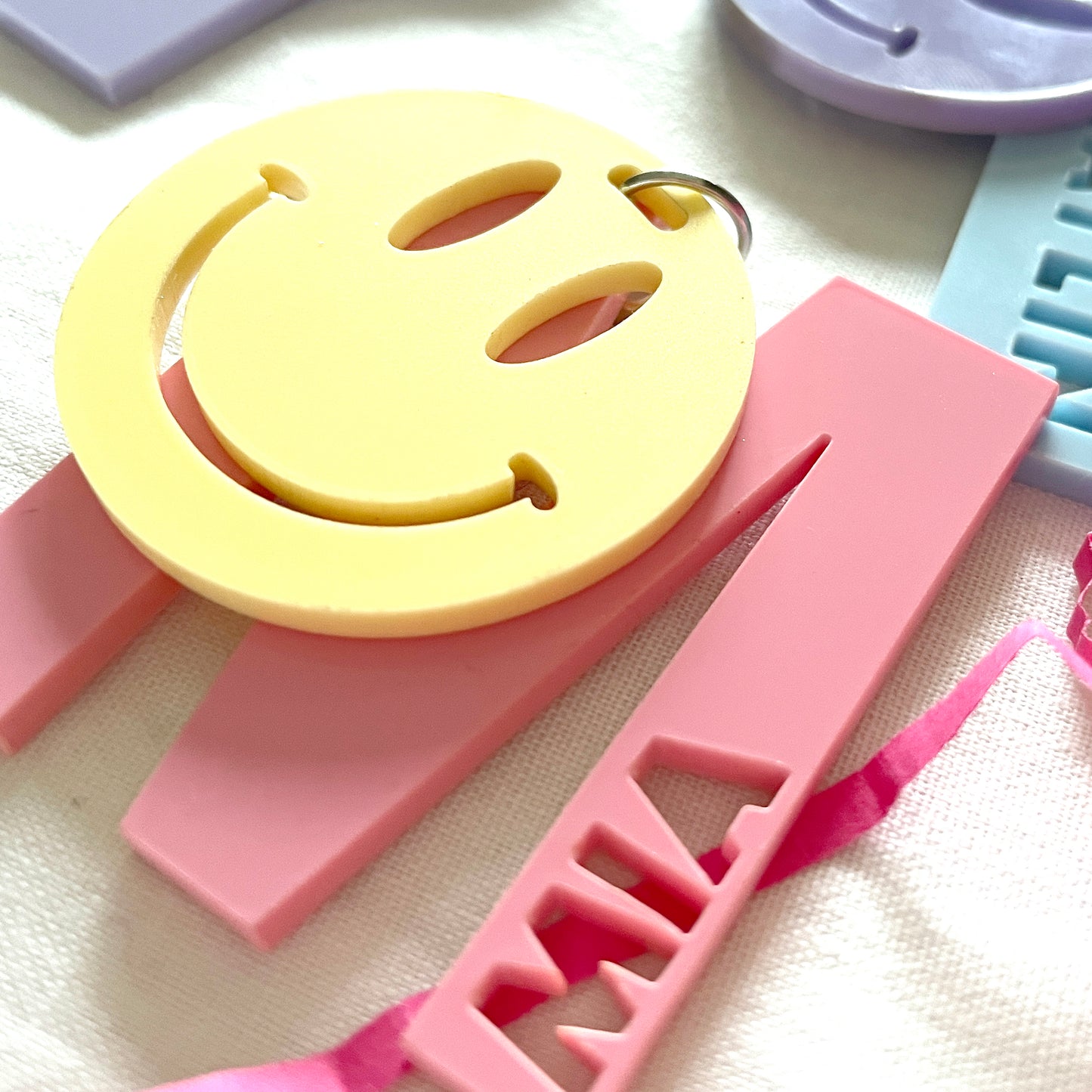 Letter and smiley face acrylic keyring
